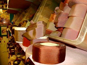 Pink- and red-hued ribbons in Gary White's hat shop