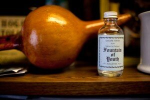 a small glass bottle labeled "fountain of youth"